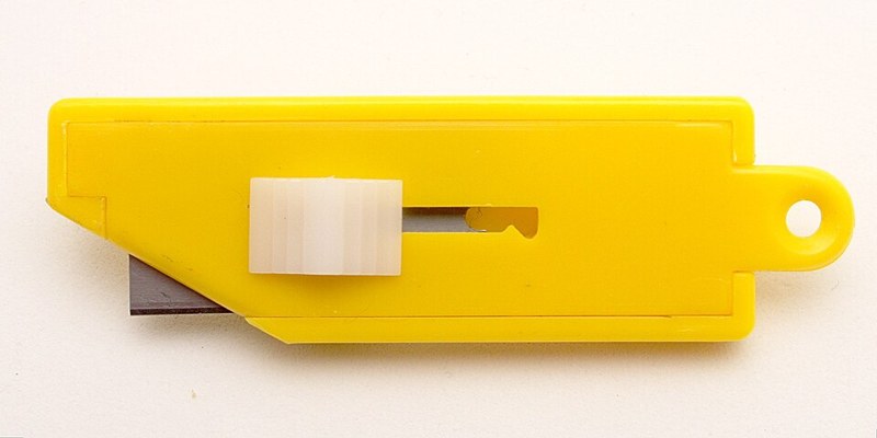 Photograph of yellow box cutter.