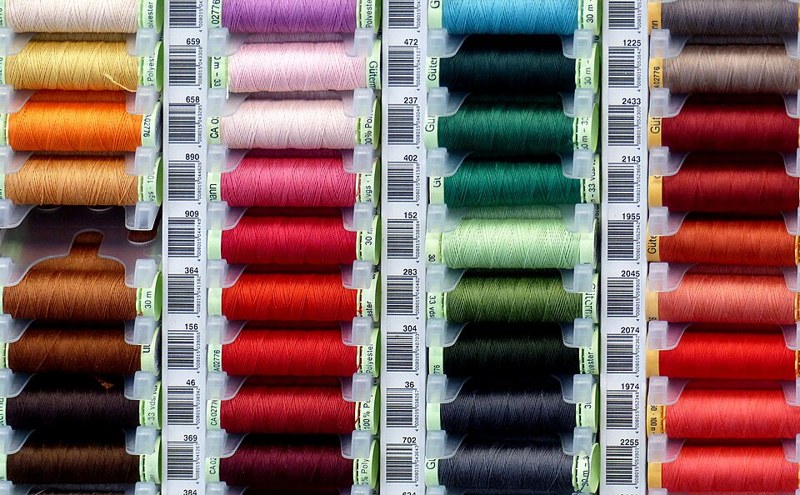 Photograph of sewing thread assortment.