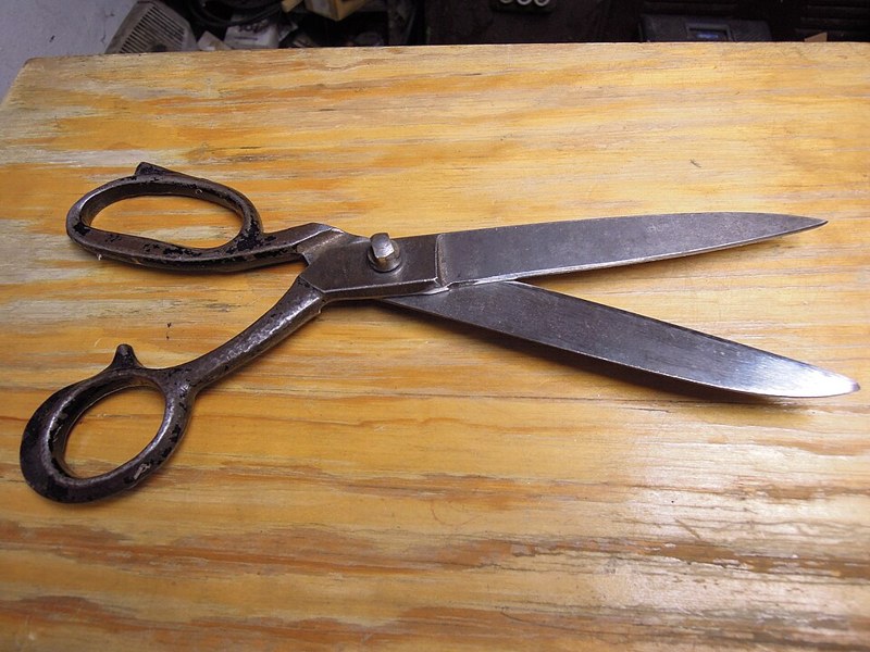 Photograph of large metal scissors.