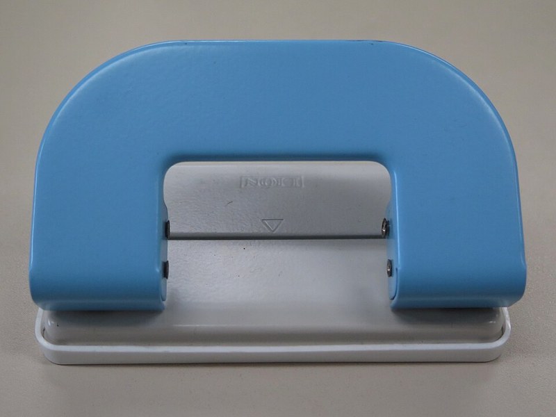 Photograph of two-hole paper punch.