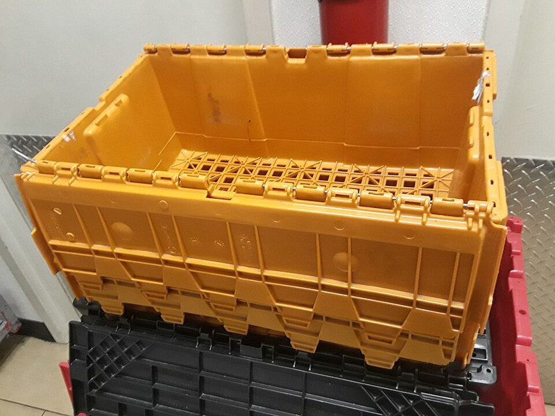 Photograph of orange storage crate.